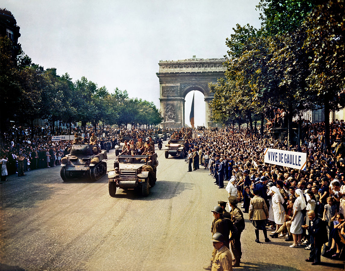 Troops of the French 2nd Armored Division parade down the Champs-Élysées on 26 August 1944.