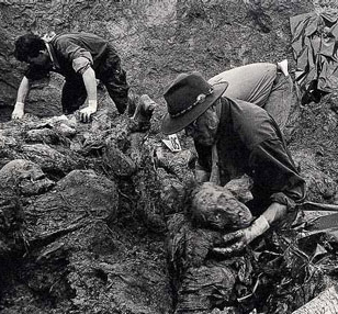 Investigators exhume bodies at a mass grave at Srebrenica in 1996.