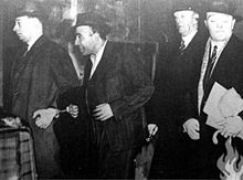 Udham Singh, a survivor of the massacre, being led away by authorities.