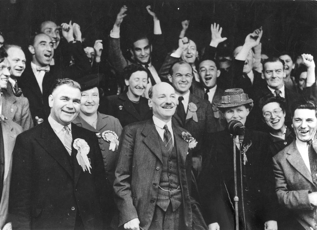 Out of the Wilderness: Attlee (front, center) celebrates victory in the general election, July 28, 1945.