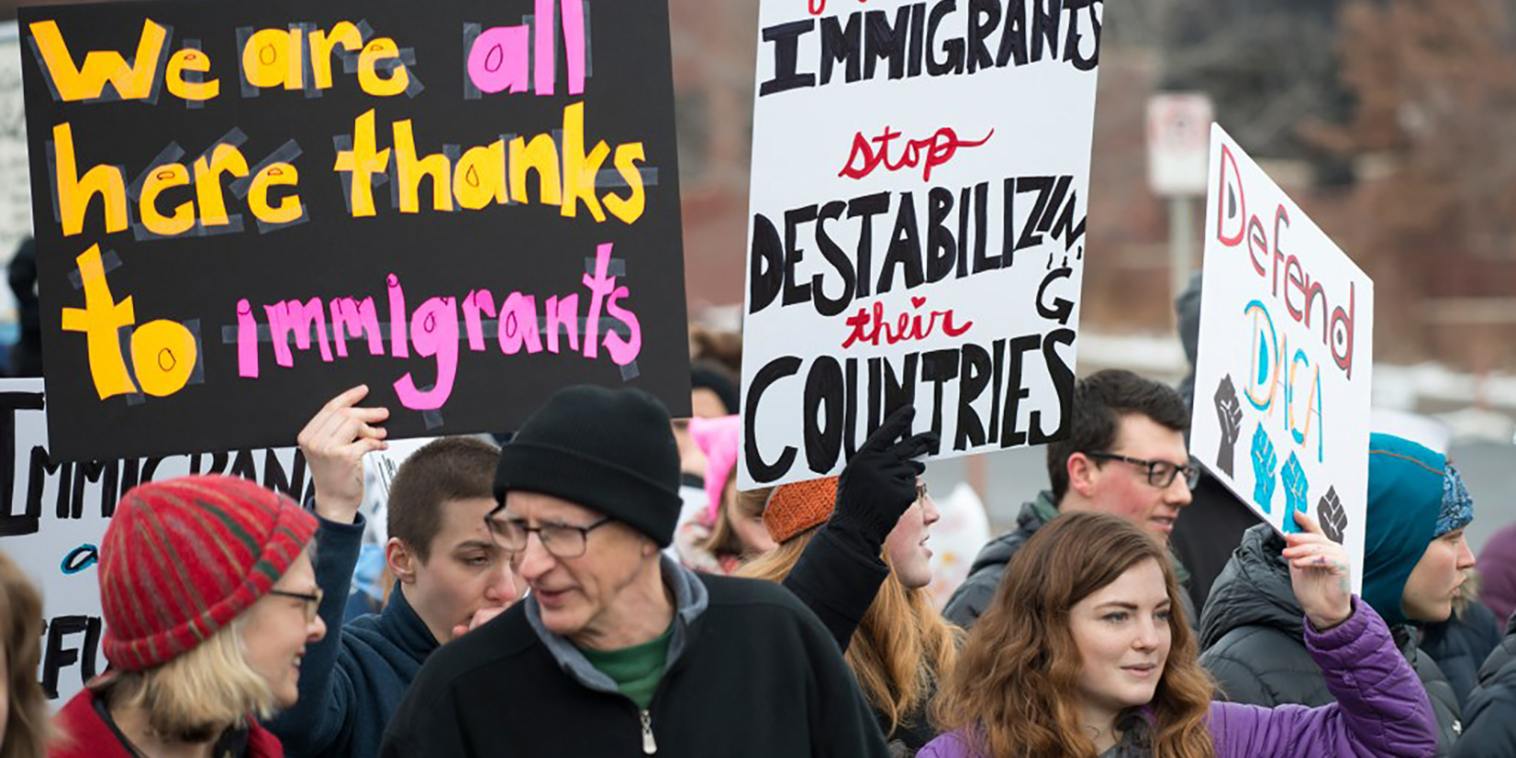 Protesters with signs in support of immigrants: "We are all here thanks to immigrants", "If you don't want immigrants, stop destabilizing their countries"; "Defend DACA"