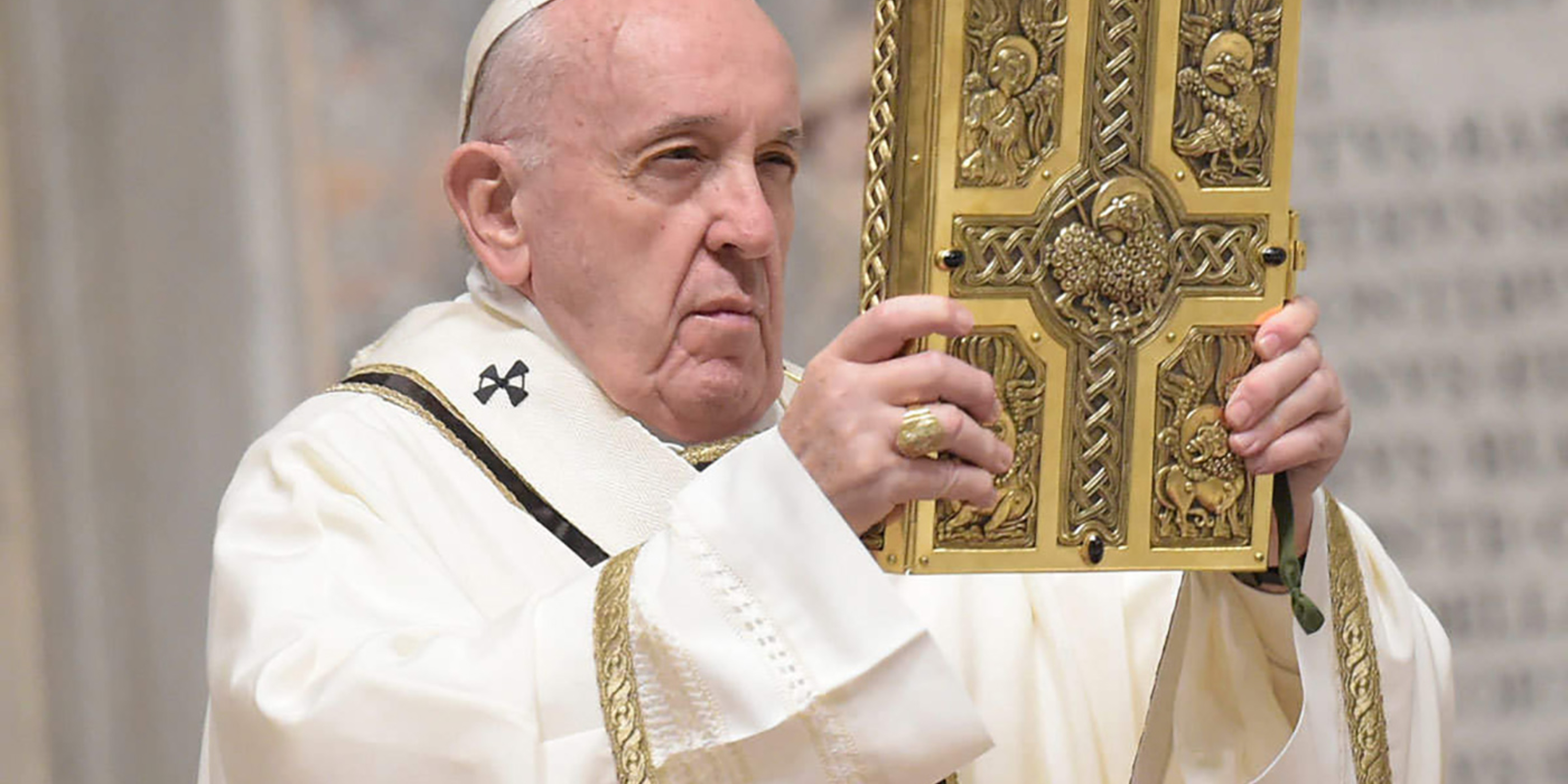 Pope Francis holding Bible