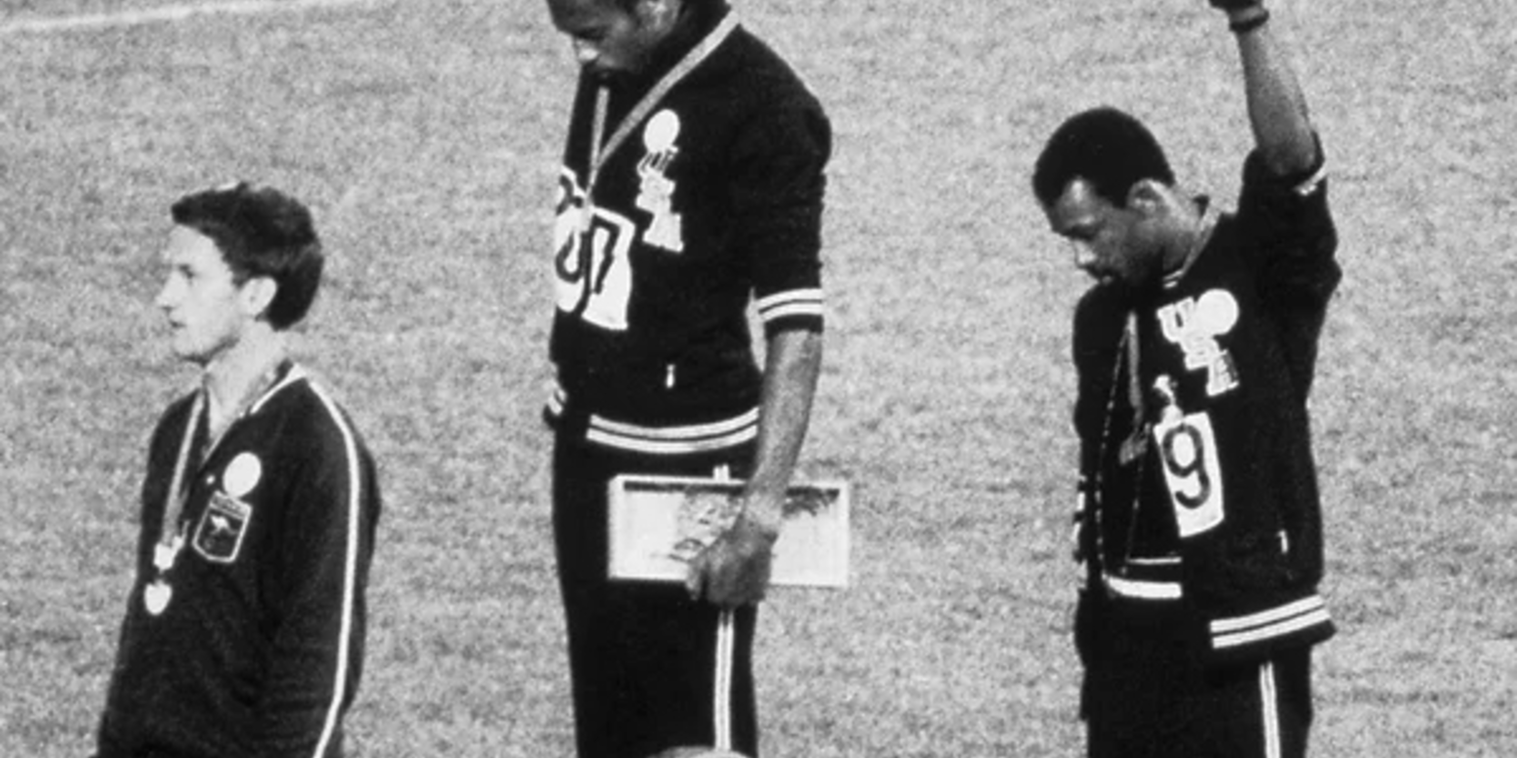 Tommie Smith and John Carlos at 1963 Olympics raising fists in protest - Photo by Bettmann Collection/Getty Images 