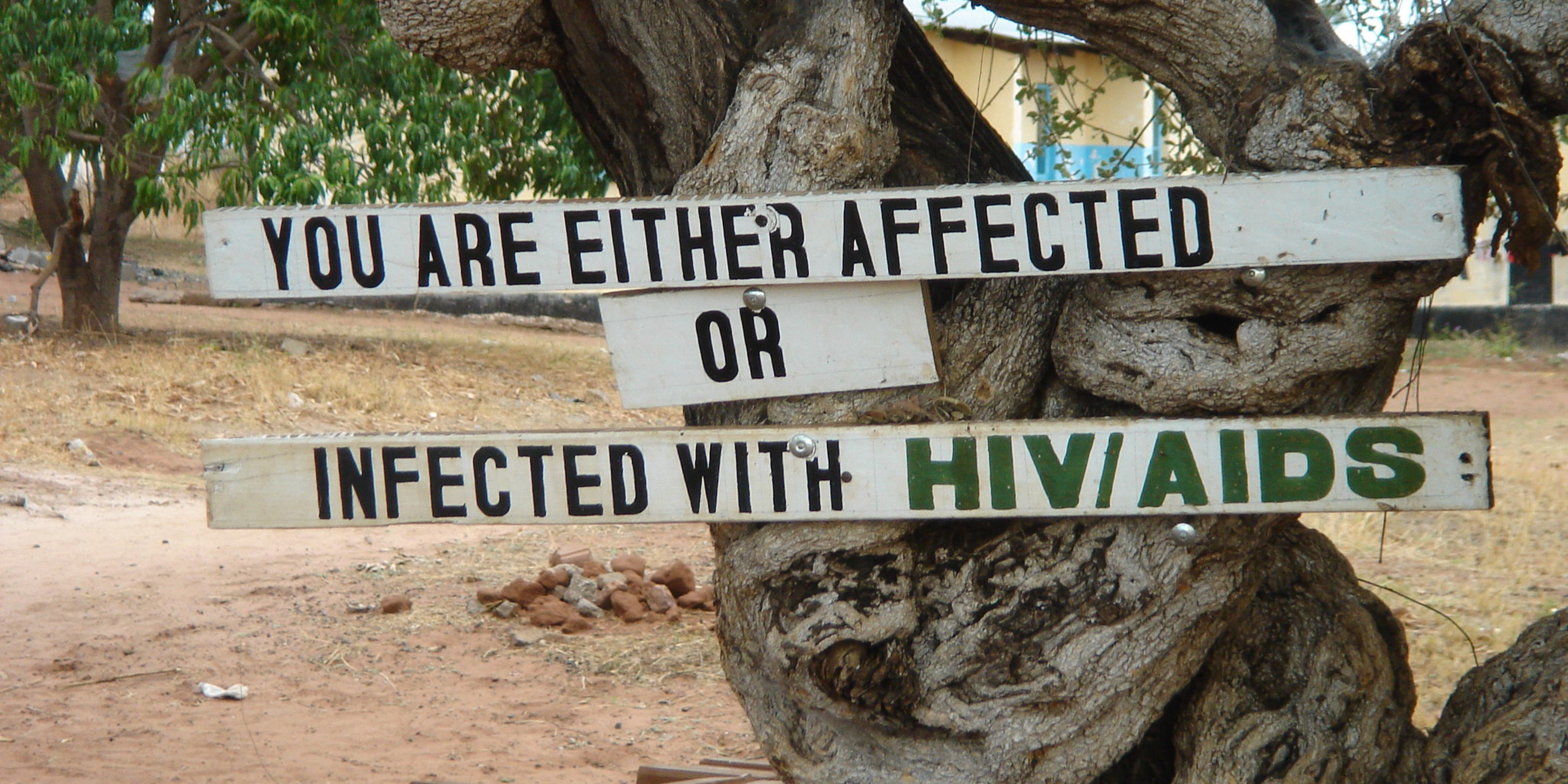 sign reading You are either affected or infected with HIV/AIDS in Zambia