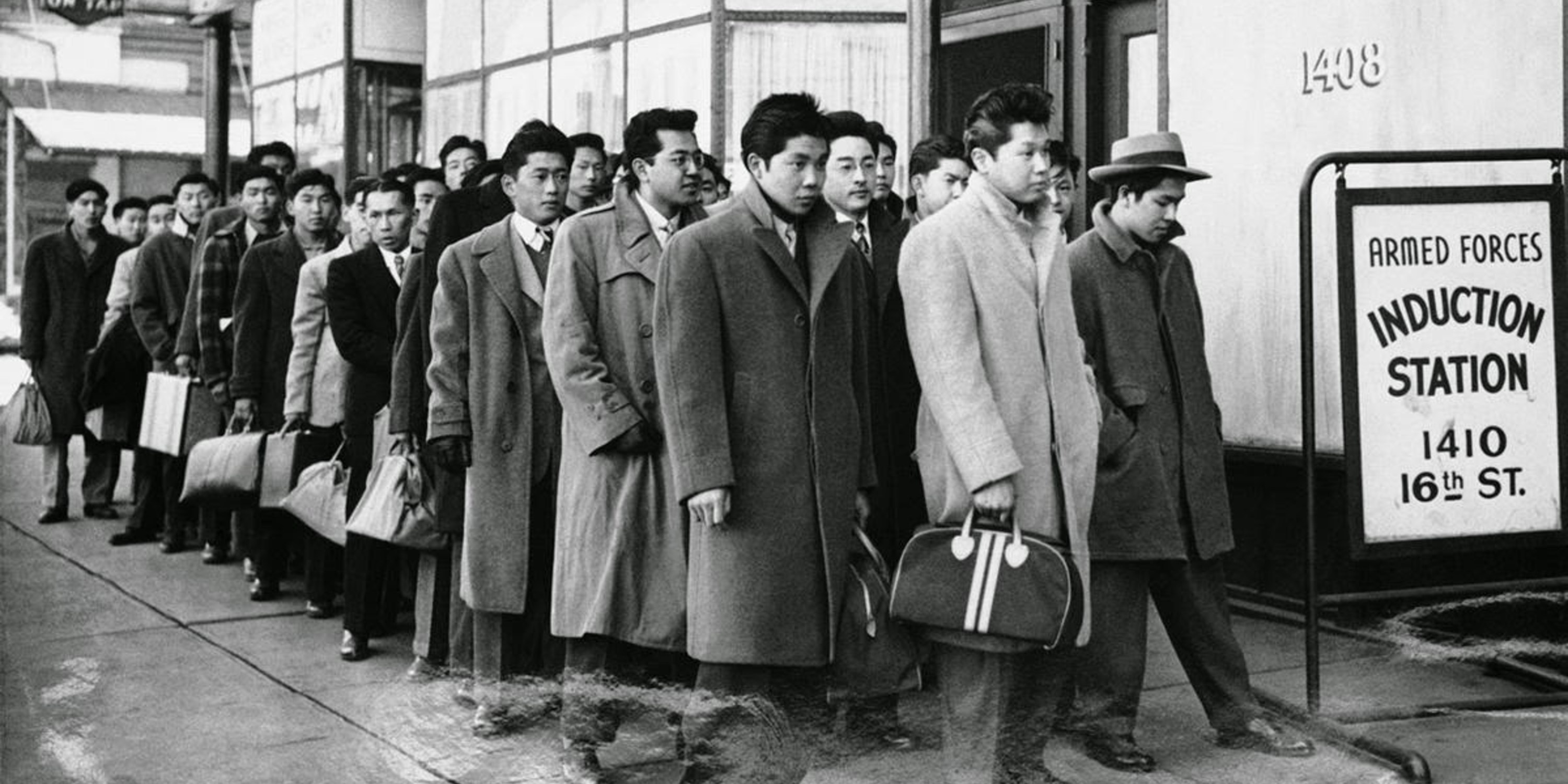 Japanese people in line at induction station during WWII