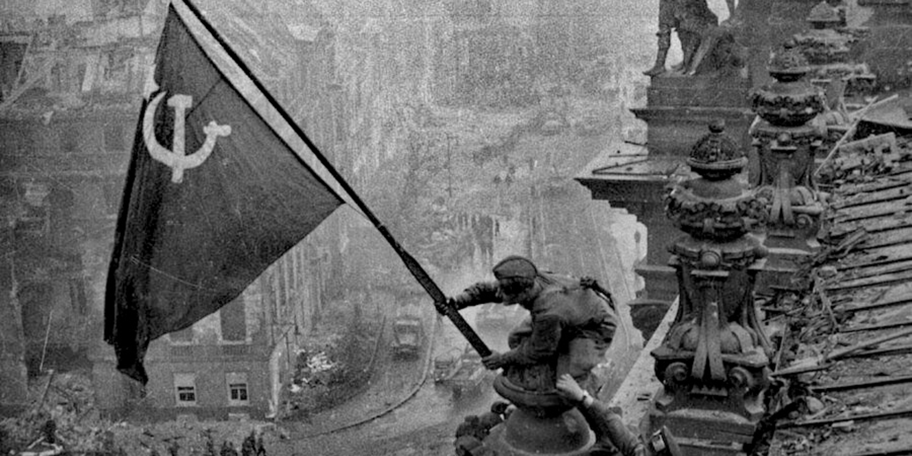 Raising a Flag over the Reichstag by Yevgeny Khaldei (1945).