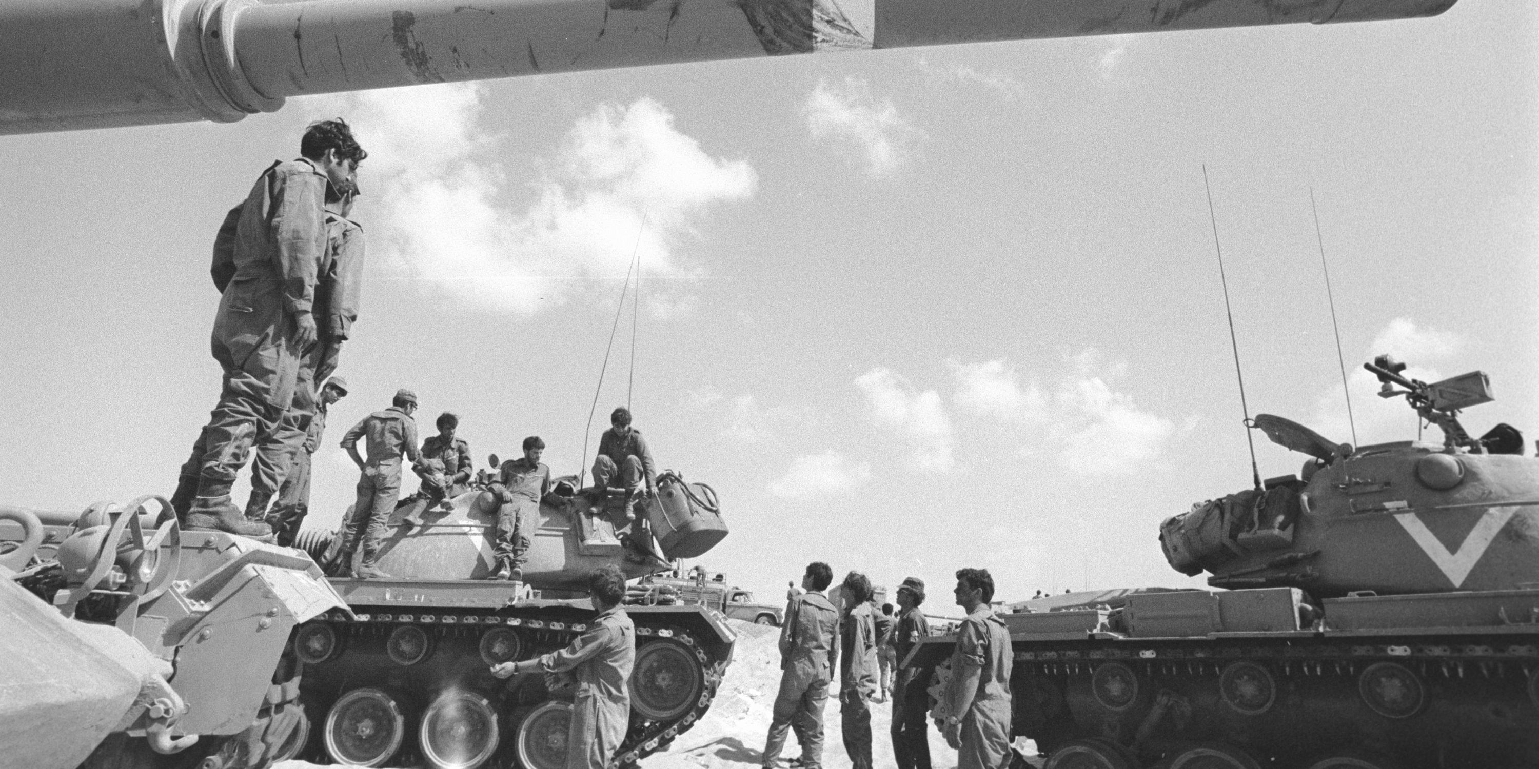 Israeli soldiers stand around their tanks during the Yom Kippur War.
