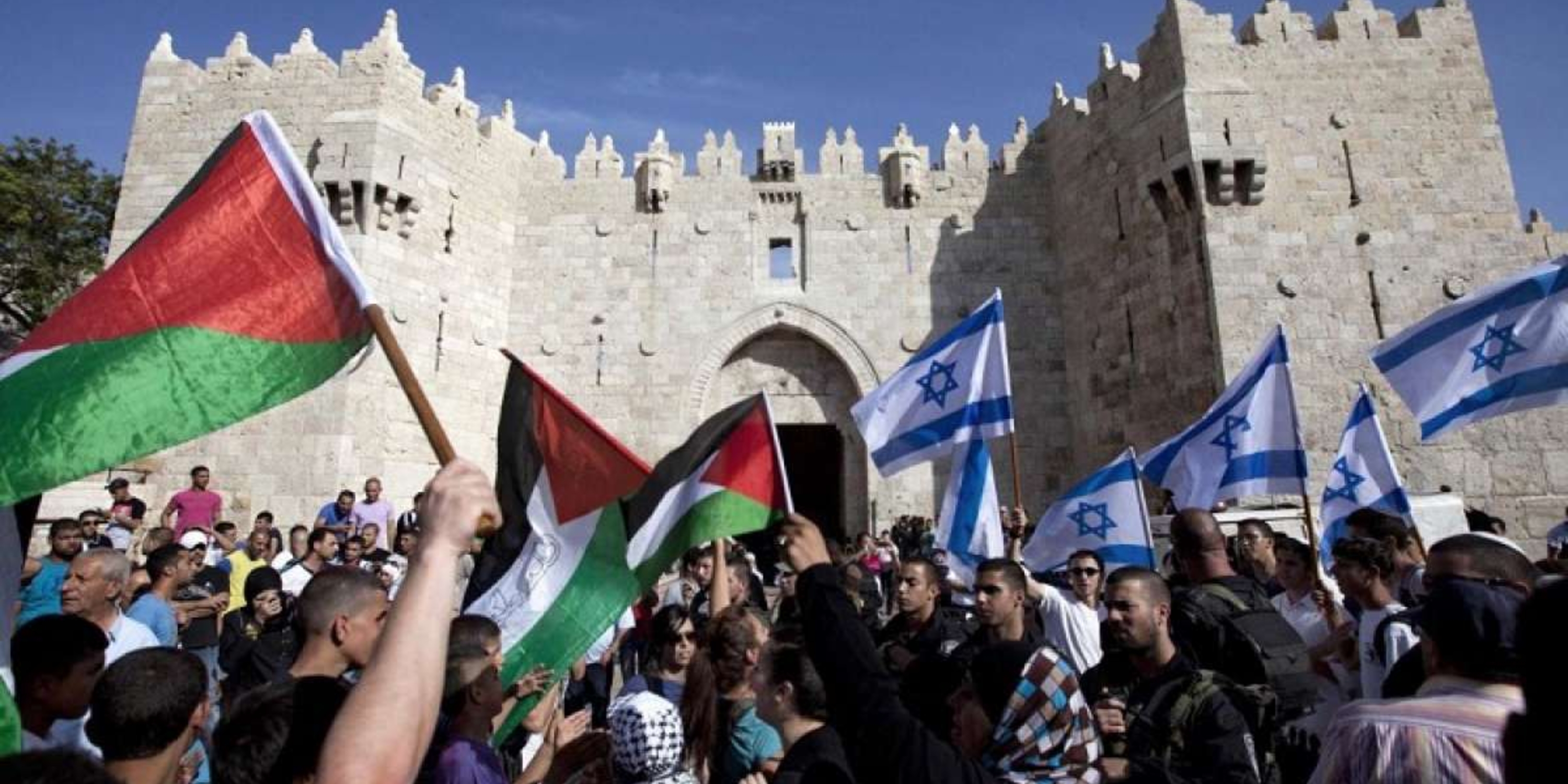 people with palestinian flags and people holding flags of Israel