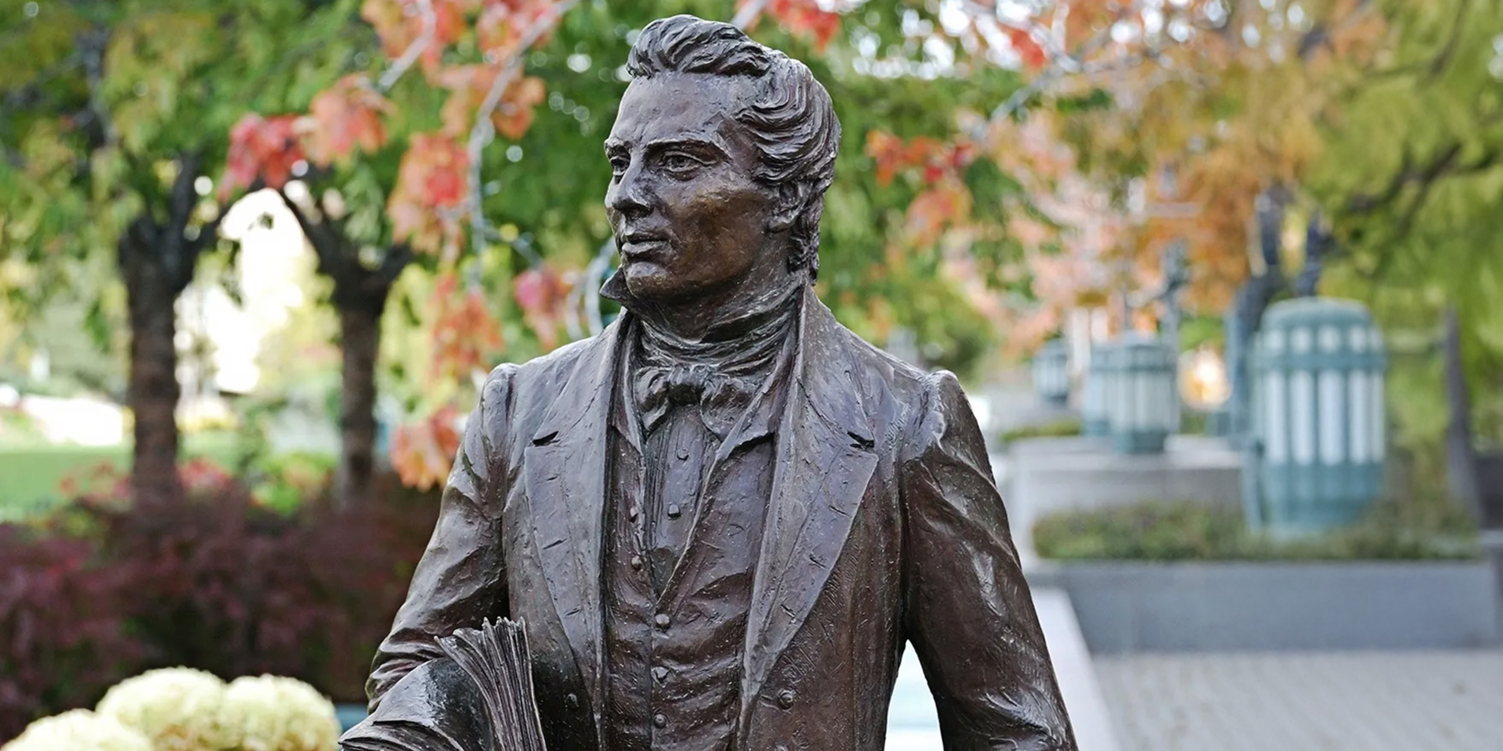 statue of Joseph Smith in a garden