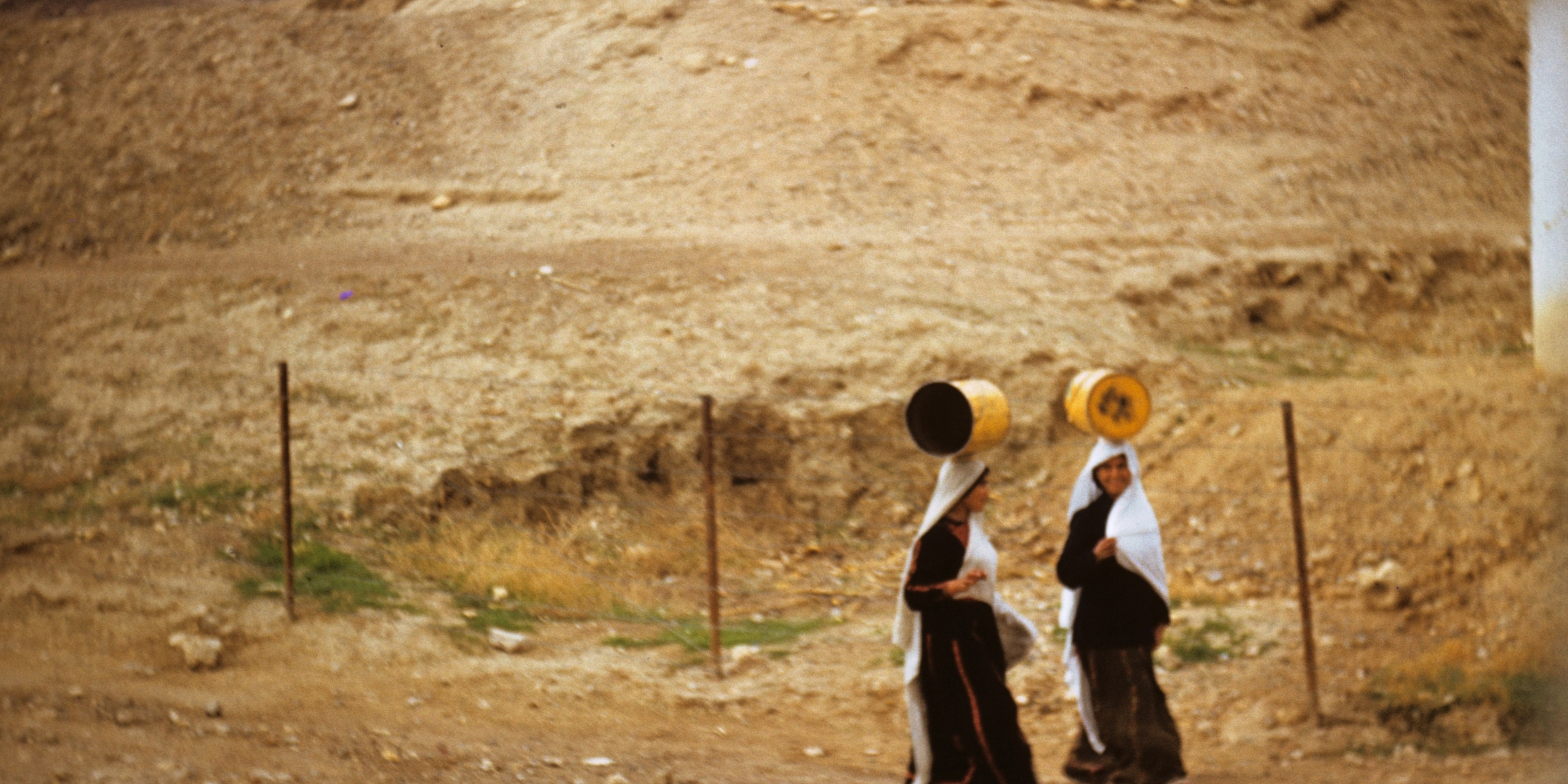 Women from Jericho's Palestinian refugee camp going to fetch water, 1961.