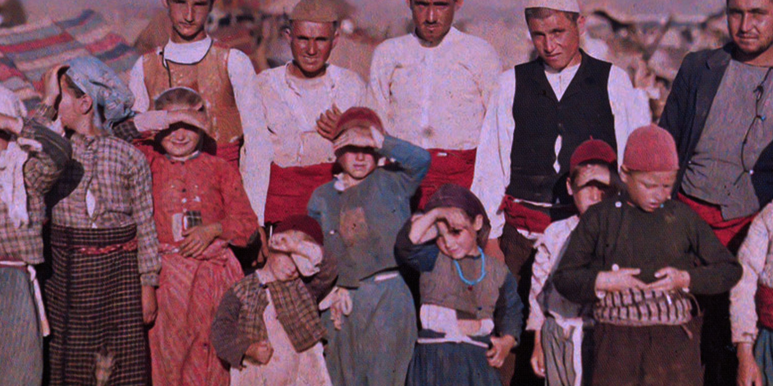 A group of Turkish refugees from 1913 standing in a group outside