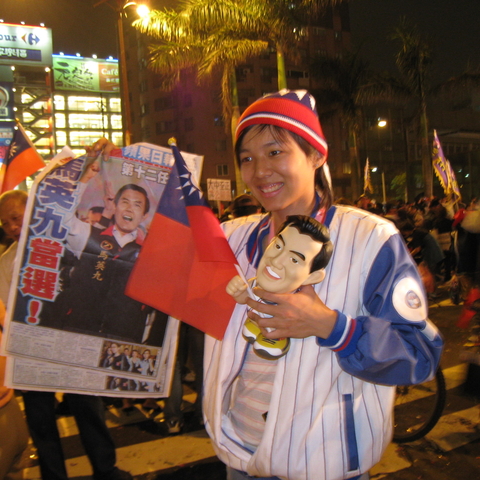 A baseball-crazy KMT fan shows her support for candidate Ma Ying-Jeou