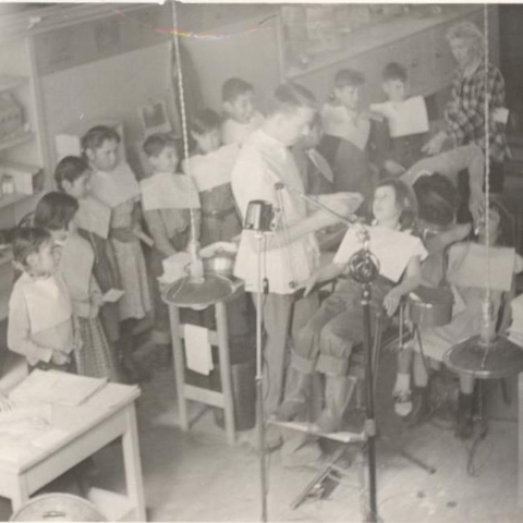 A dentist examining children’s teeth at the Pine Ridge Indian Reservation.