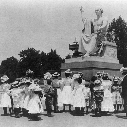 Black schoolchildren in front of the Horatio Greenough statue of George Washington.