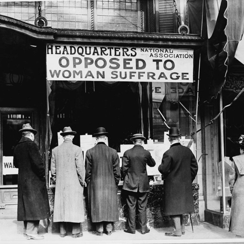 Men looking at the window display of the National Anti-Suffrage Association.