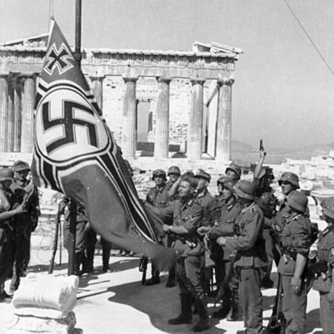 German soldiers raising their flag over the Acropolis.
