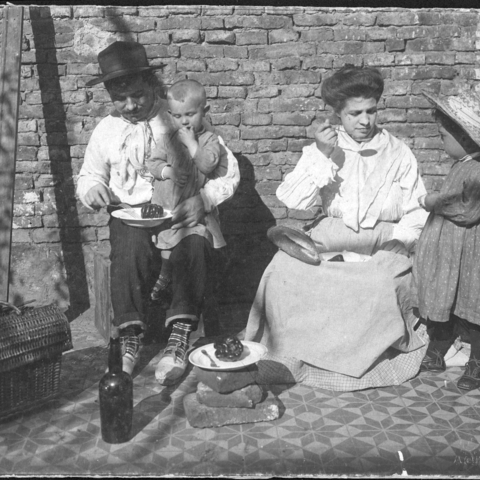 An immigrant family enjoying lunch in Buenos Aires.