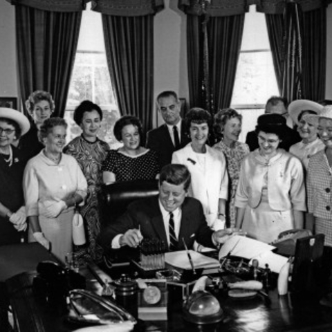 President John F. Kennedy with members of the American Association of University Women.