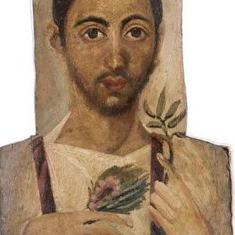 A mummy portrait of a man holding a plant.