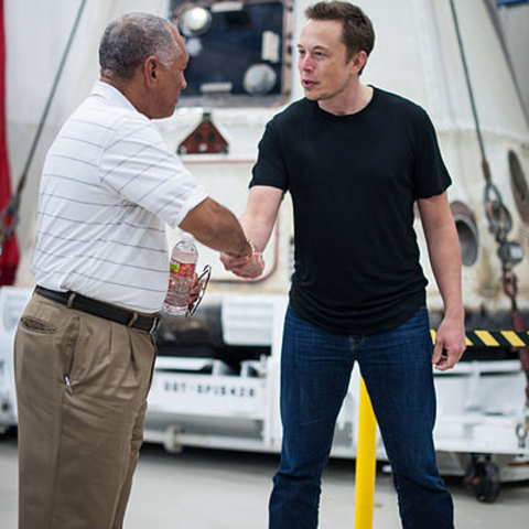 NASA Administrator Charles Bolden congratulating SpaceX CEO Elon Musk.