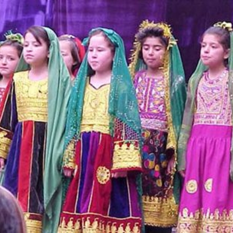 Afghan girls sing at a celebration of International Women's Day, March 8 2002