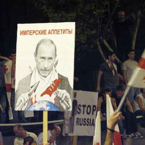 Demonstration in Tbilisi for a free and undivided Georgia, August 2008. The placard, with a picture of Russian Prime Minister Vladimir Putin, says "Imperial Appetites"