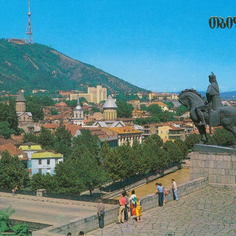 A postcard showing a monument to Vakhtung Gorgasali, the founder of Tbilisi; with the Holy Mountain Mtatsminda in the background