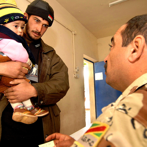 Local resident with daughter at a medical clinic.