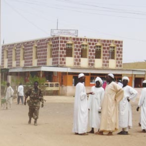 Armed Janjawid (in camoflage) in a Sudanese market.