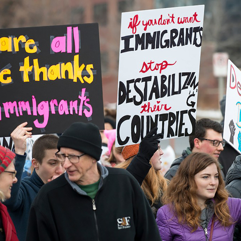 Protesters with signs in support of immigrants: "We are all here thanks to immigrants", "If you don't want immigrants, stop destabilizing their countries"; "Defend DACA"