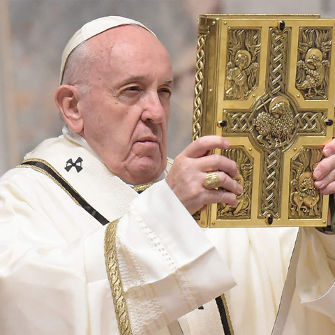 Pope Francis holding Bible