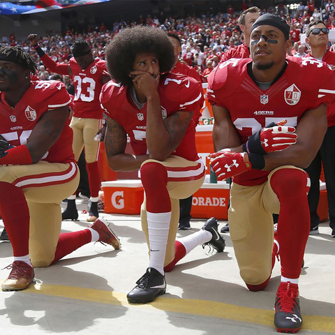 Colin Kaepernick and teammates kneeling