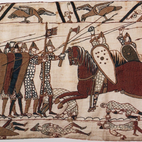Scene from the 11th century Bayeaux Tapestry depicting Norman cavalry attacking Anglo-Saxon soldiers.