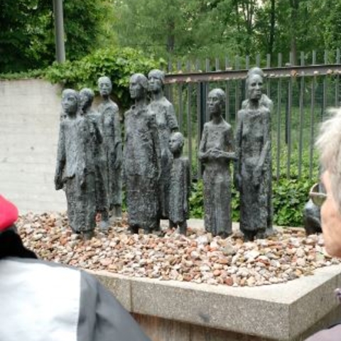 A memorial to Holocaust victims in front of a Jewish cemetery.