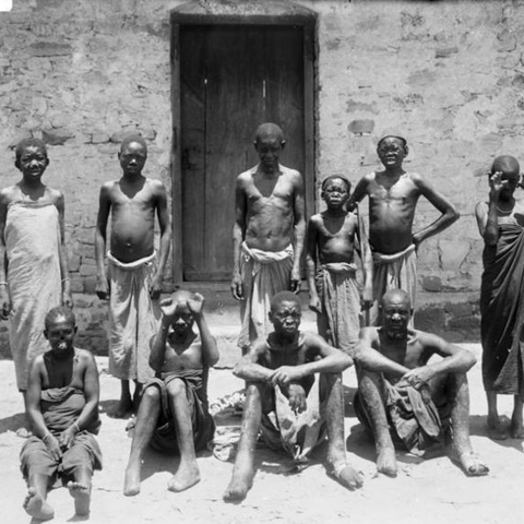 African young people in front of a building