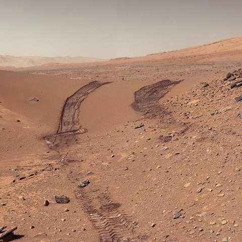 The Mars explorer Curiosity's view back at its own tracks after crossing a sand dune in 2014.