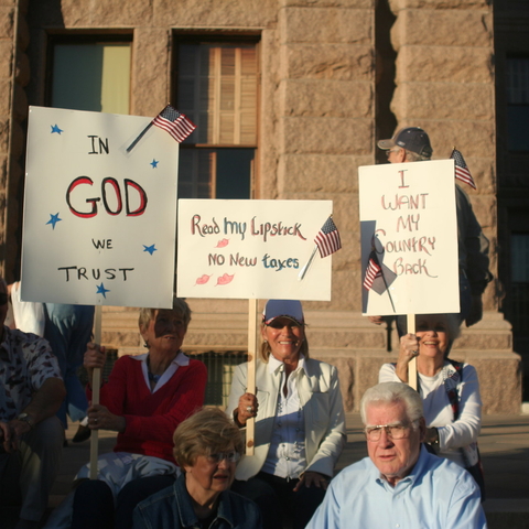members of the Tea Party holding signs