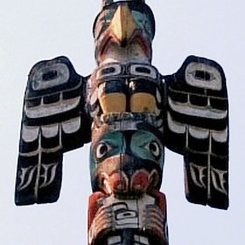 The image of a Thunderbird on top of a totem pole
