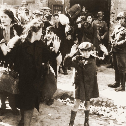 Infamous photograph of German soldiers rounding up Jews for deportation in the Warsaw Ghetto, 1943.