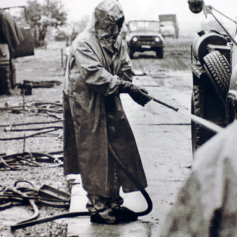 A military reservist, called to service in the wake of the disaster, involved in the decontamination process.