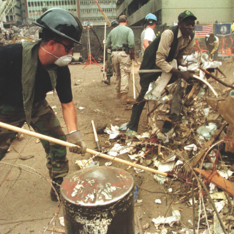 A U.S. FBI agent sorts through rubble. (Photo by the U.S. Federal Bureau of Investigation)