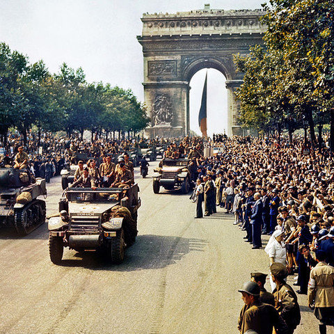 Troops of the French 2nd Armored Division parade down the Champs-Élysées on 26 August 1944