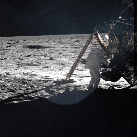 Neil Armstrong stands by the Lunar Module "Eagle" during the first walk on the moon in 1969.