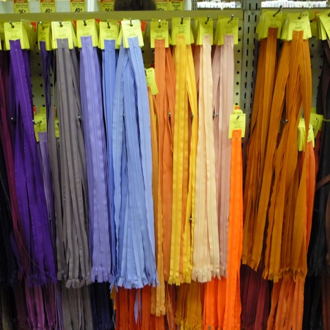 a sales display of many zippers