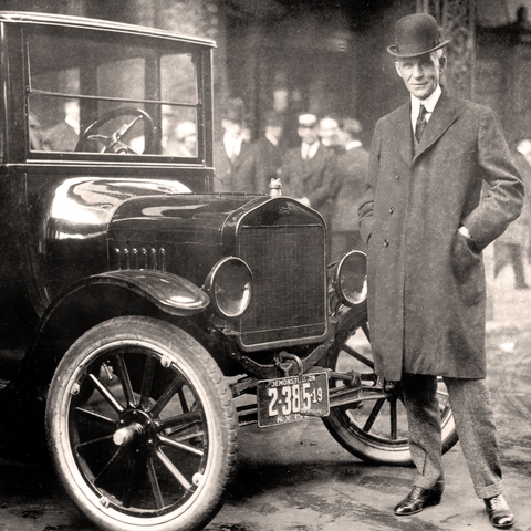 Henry Ford with a Model T in 1921.