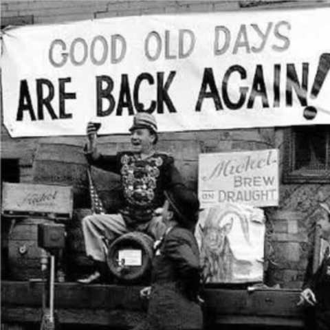 Man Celebrating Repeal Day with a banner that says "Good Old Days Are Back Again!"