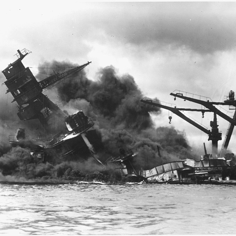 USS ARIZONA sinking during the Pearl Harbor attack in 1941.