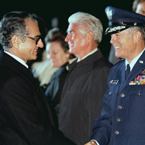 Mohammed Reza Pahlavi, Shah of Iran, shakes hands with a US Air Force general officer prior to his departure from the United States