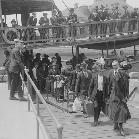 People arriving at Ellis Island in the early 20th century.