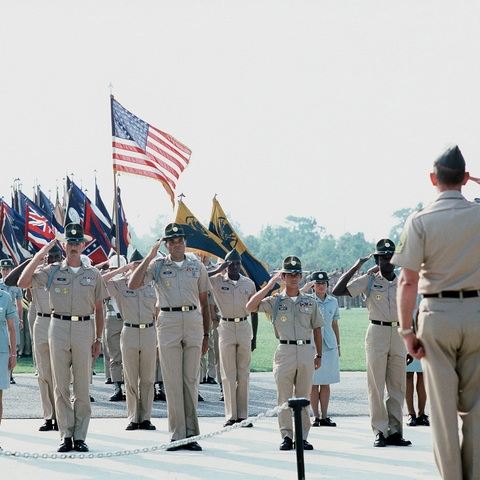 American soldiers salute while in formation in 1977.